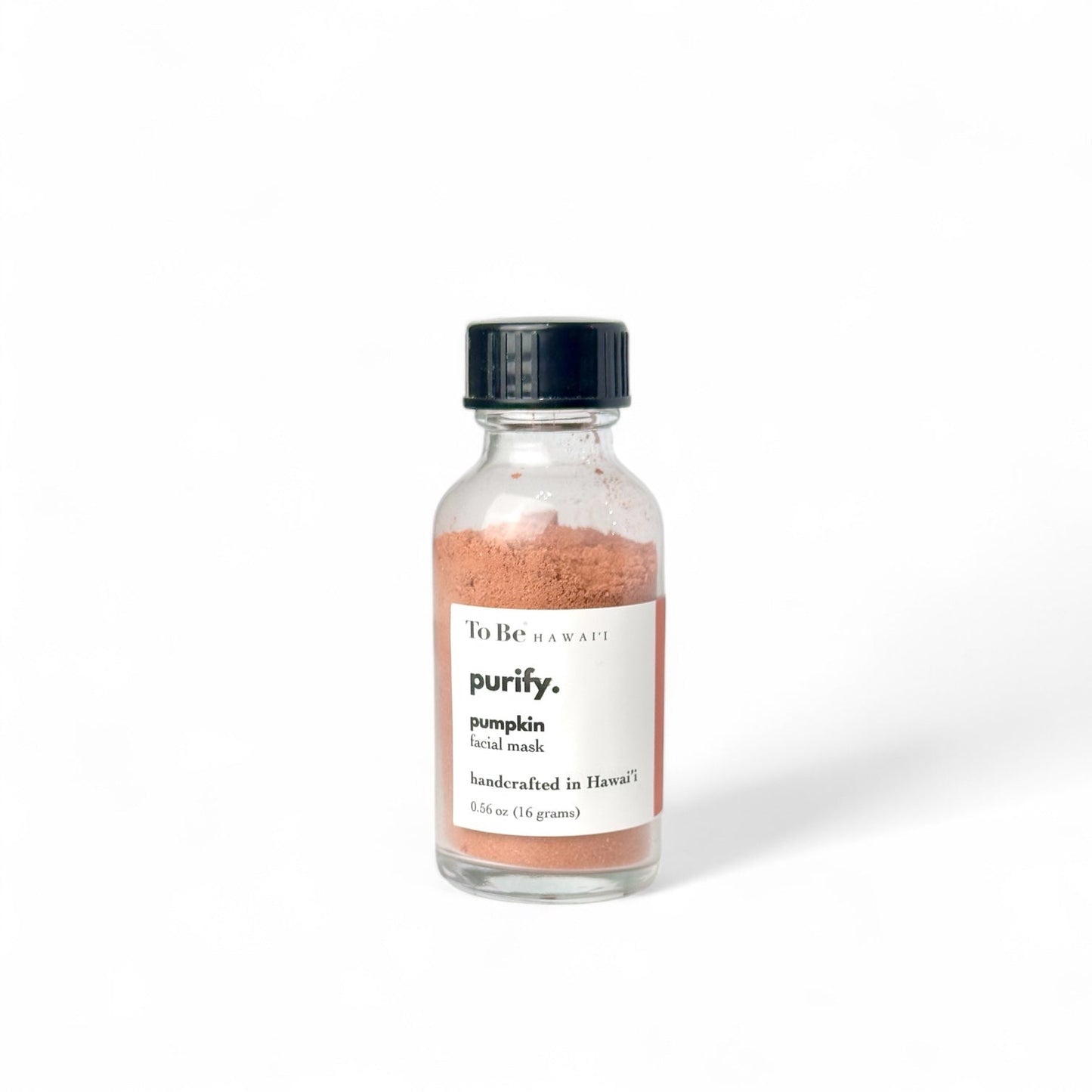 Glass bottle of 'purify' pumpkin facial mask with a black cap 