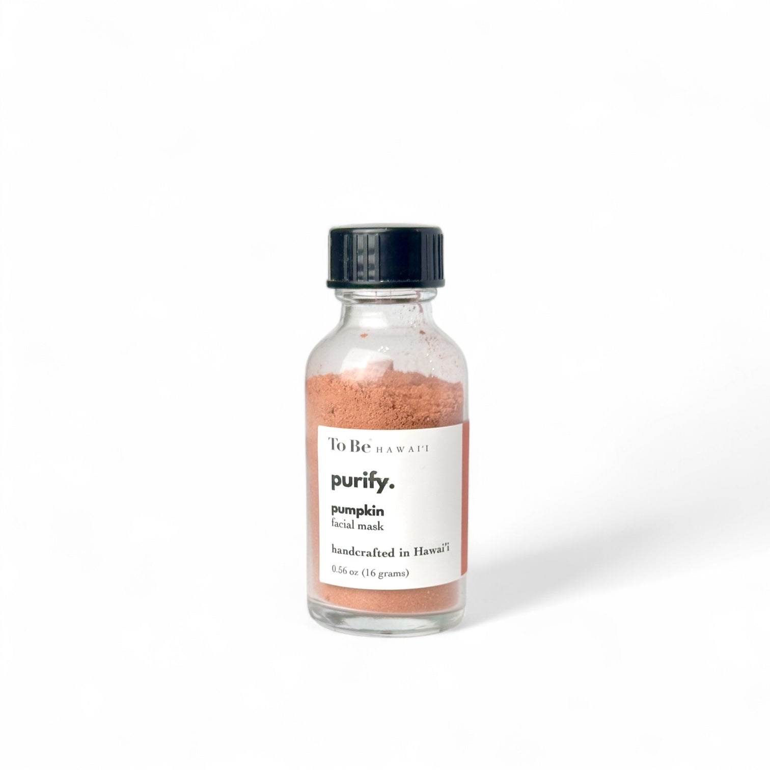 Glass bottle of 'purify' pumpkin facial mask with a black cap 