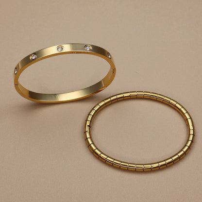 High-polished gold bangle bracelet with bezel-set zircon stones – women's luxury jewelry
