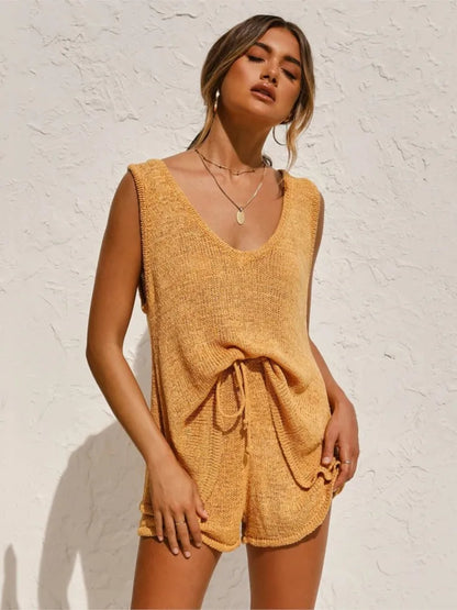 Woman wearing a yellow sleeveless top and shorts 