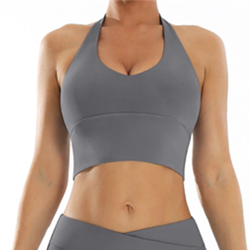 Front view of white high-support sports bra featuring push-up design and moisture-wicking nylon material for athletic performance