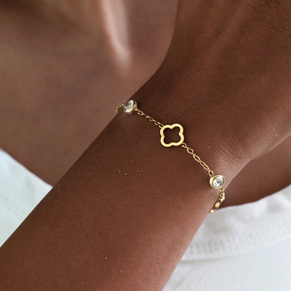  gold clover charm bracelet with bezel zirconia stones worn on wrist –  stainless steel jewelry

