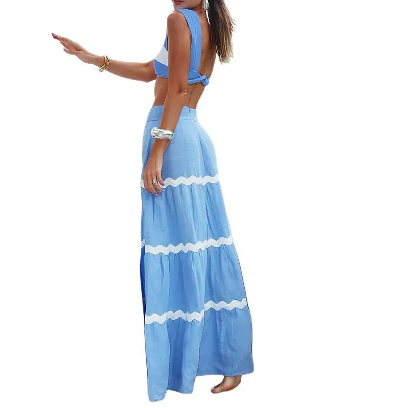 Woman wearing a blue and white striped dress 