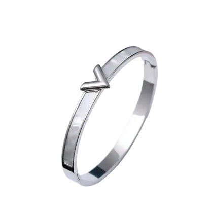Silver shell inlay bangle bracelet – sleek V-accent stainless steel jewelry for women