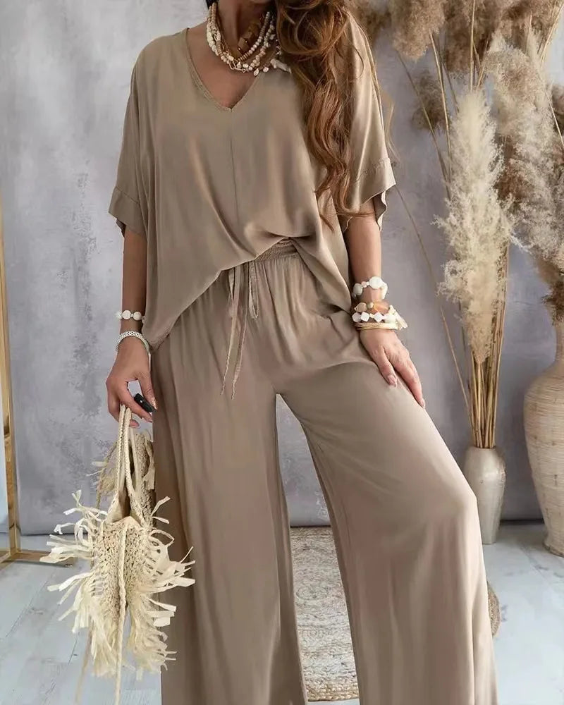 Women modeling casual printed shirt and pants outfit