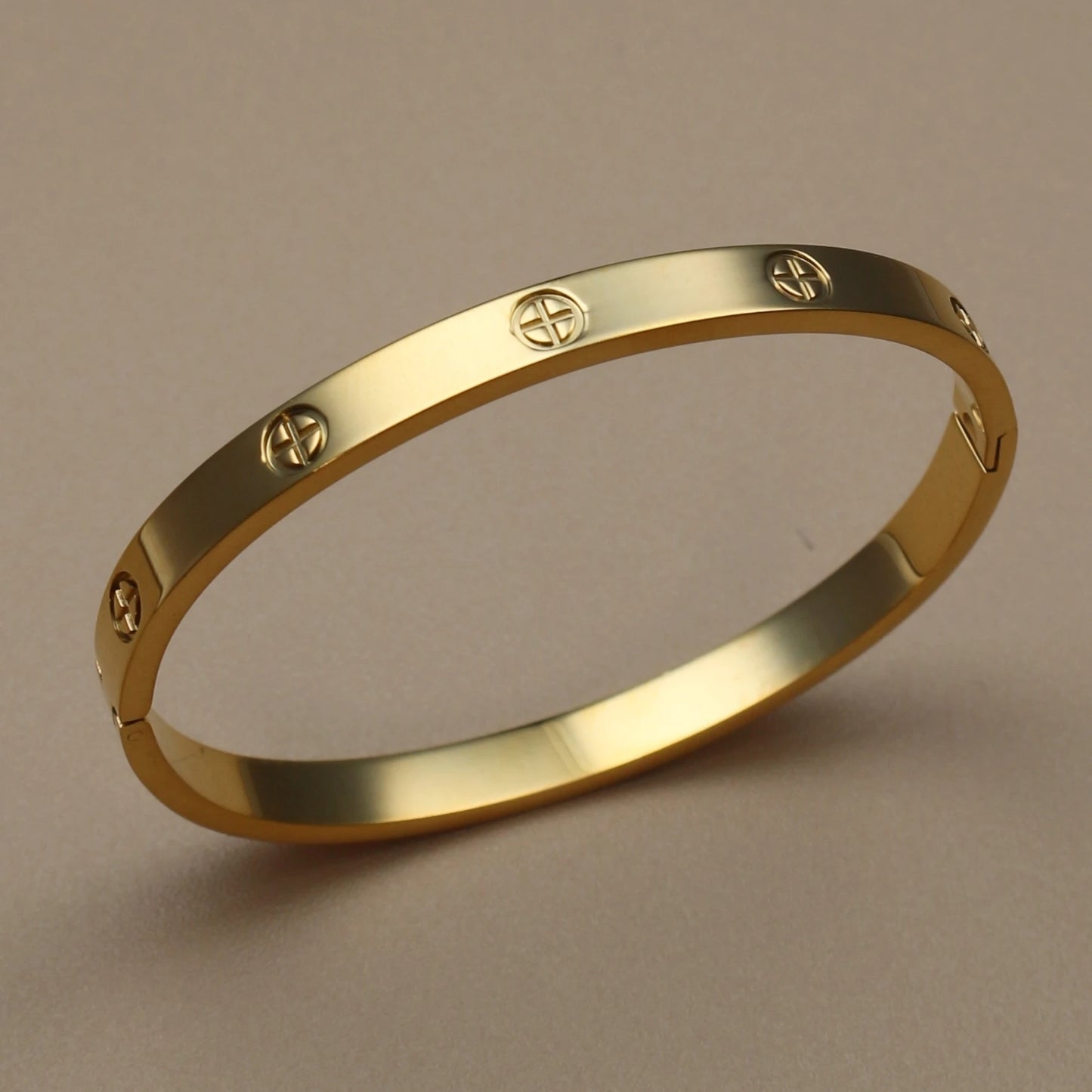 Gold tone rigid bangle bracelet with textured finish – stackable women's fashion jewelry