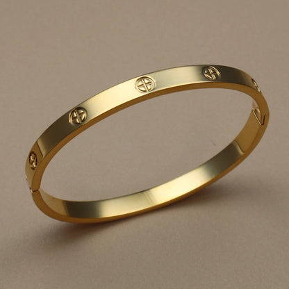 Gold tone rigid bangle bracelet with textured finish – stackable women's fashion jewelry