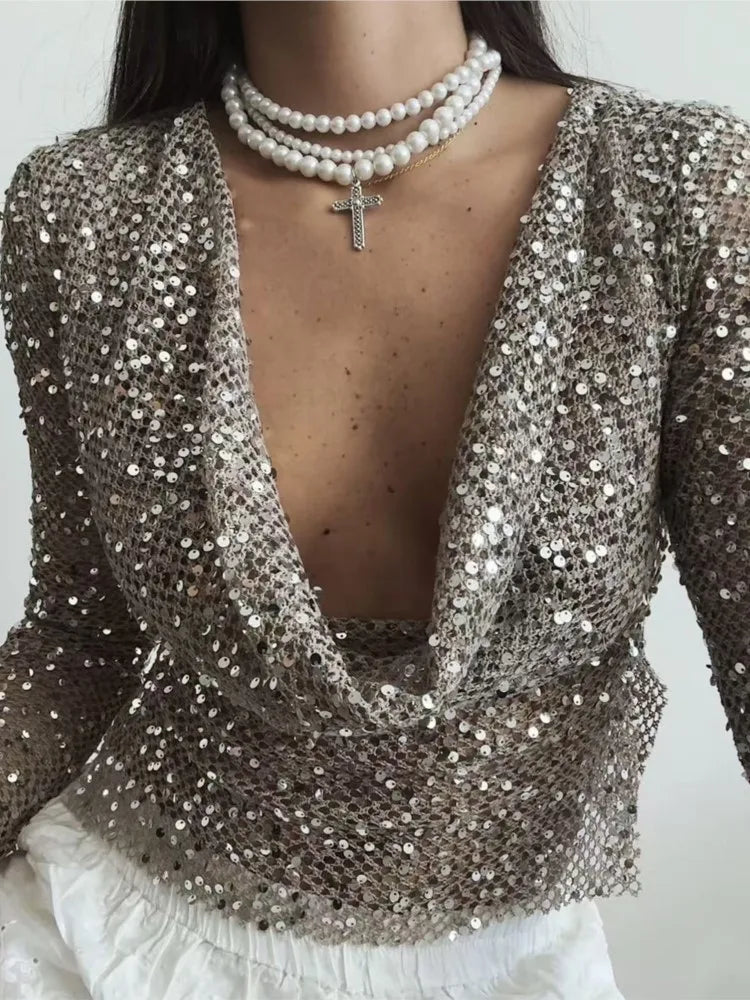 Women's shiny hollow-out sequin top in silver- front view
