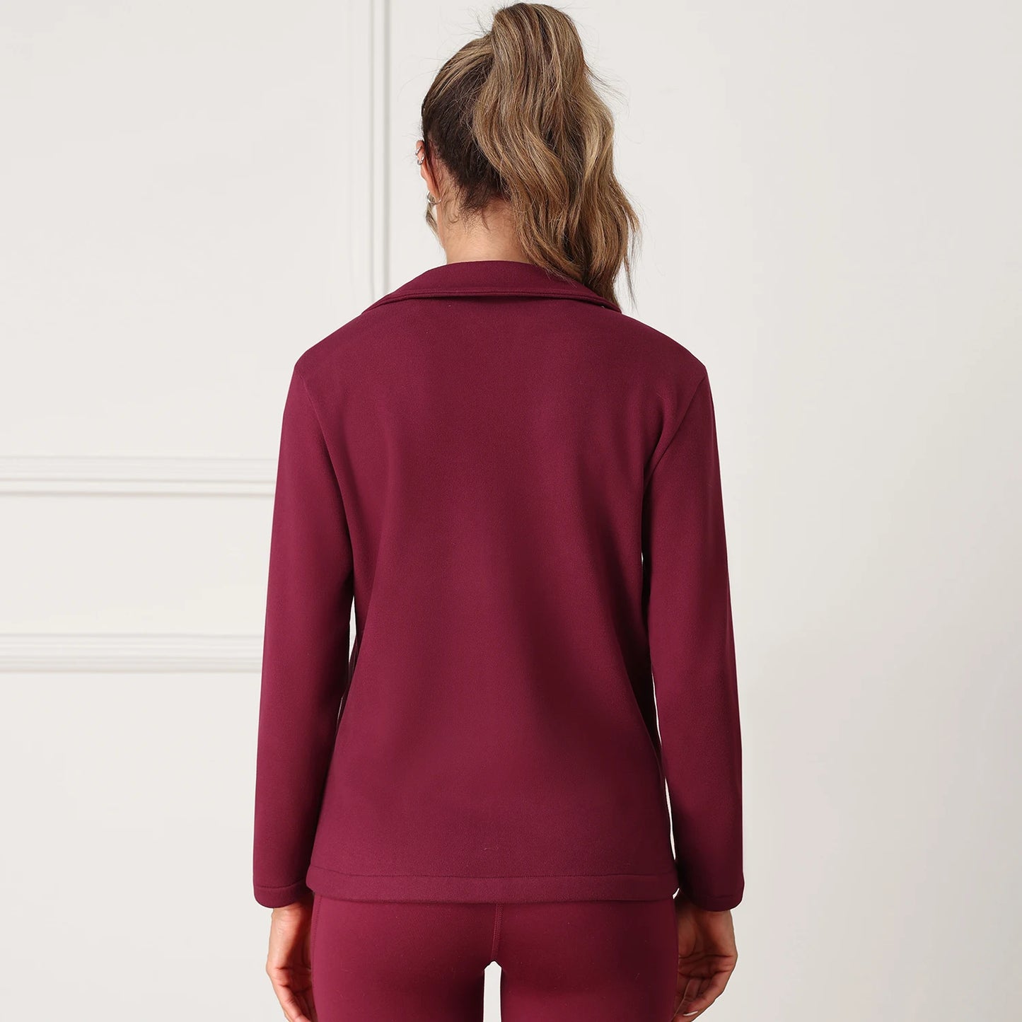 Person wearing a maroon tracksuit 