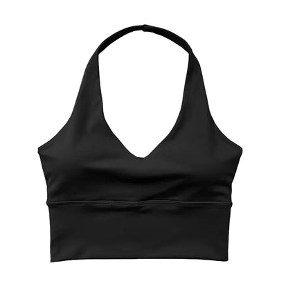 Black sports bra on a light wooden surface 