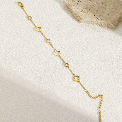 Gold four-leaf clover bracelet with crystal accents in jewelry gift box – lucky charm wrist jewelry
