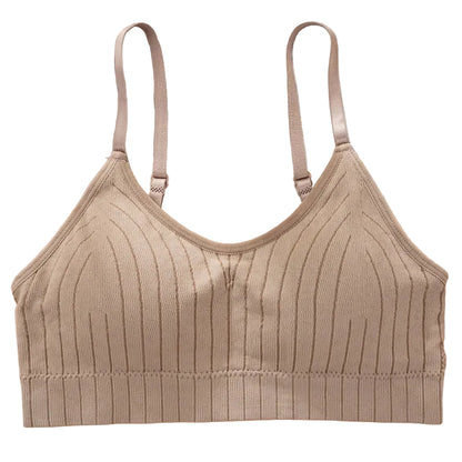 Padded cami bralette styled as layering piece under sheer top
