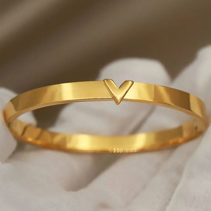 High-polish gold V-accent bangle bracelet in 316L stainless steel – minimalist wrist jewelry for women
