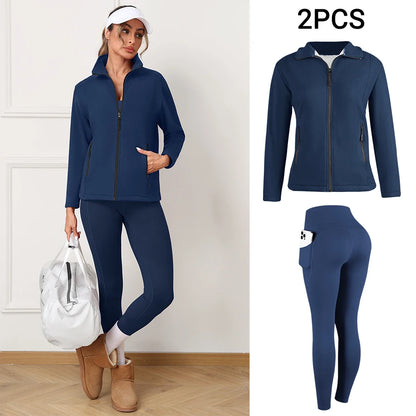 Woman wearing a navy blue athletic outfit with leggings and jacket, 