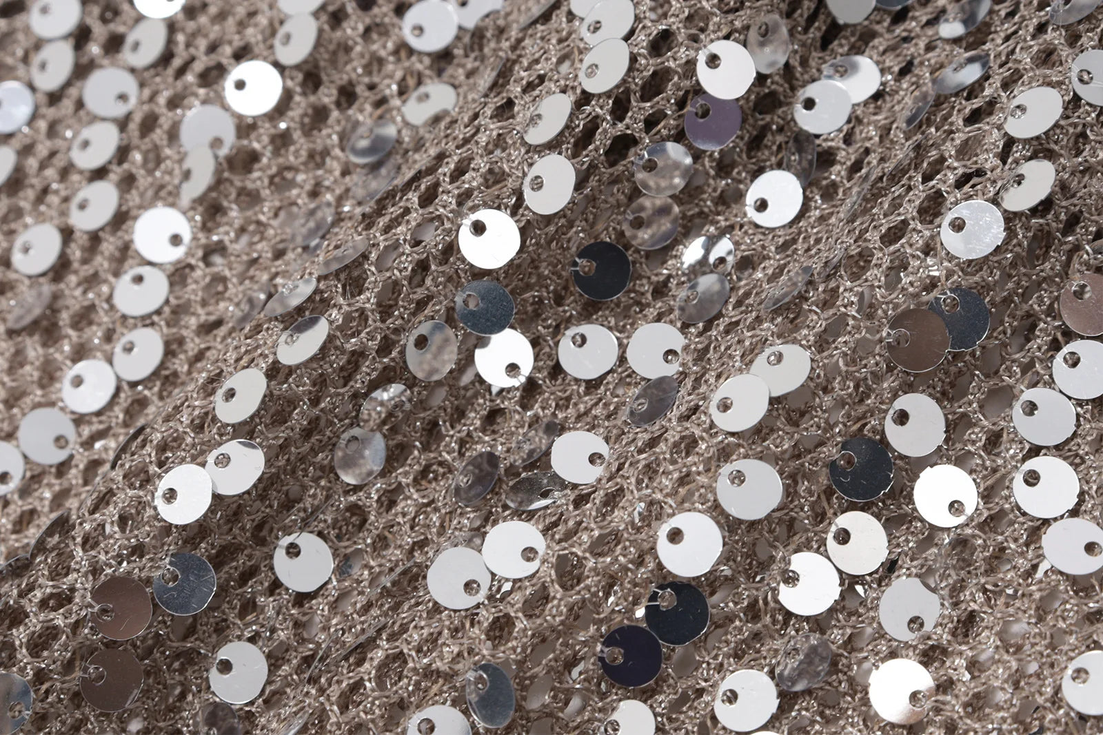 Close-up of sequined fabric with silver and black sequins
