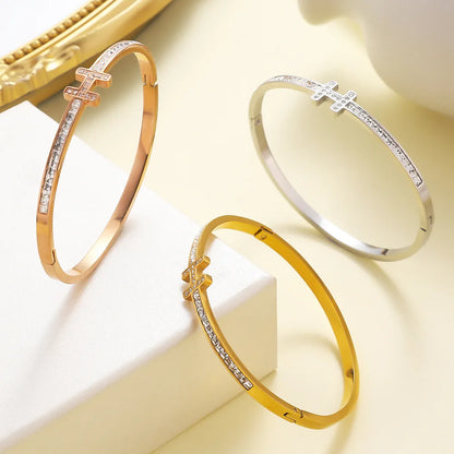 18K plated bangle with pavé cross charm and continuous crystal accent – tarnish-resistant statement bracelet

