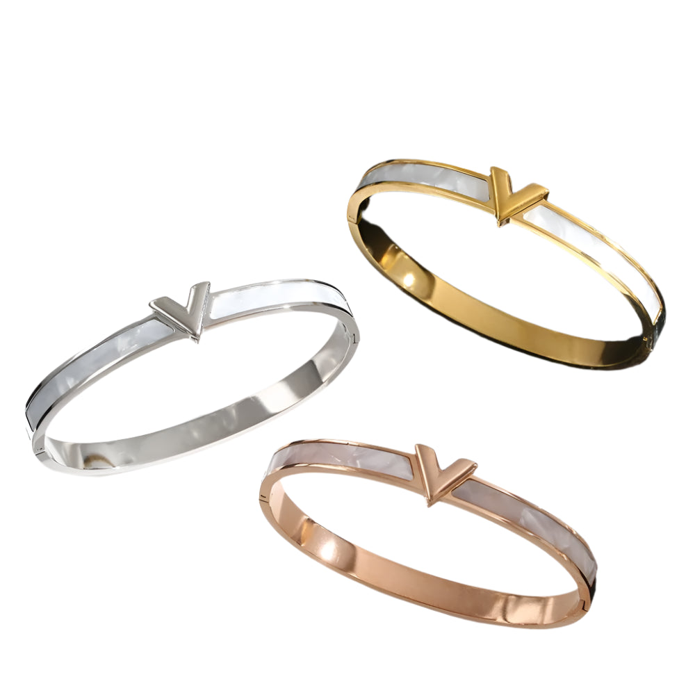 Three gold, silver, and rose gold V bangles 