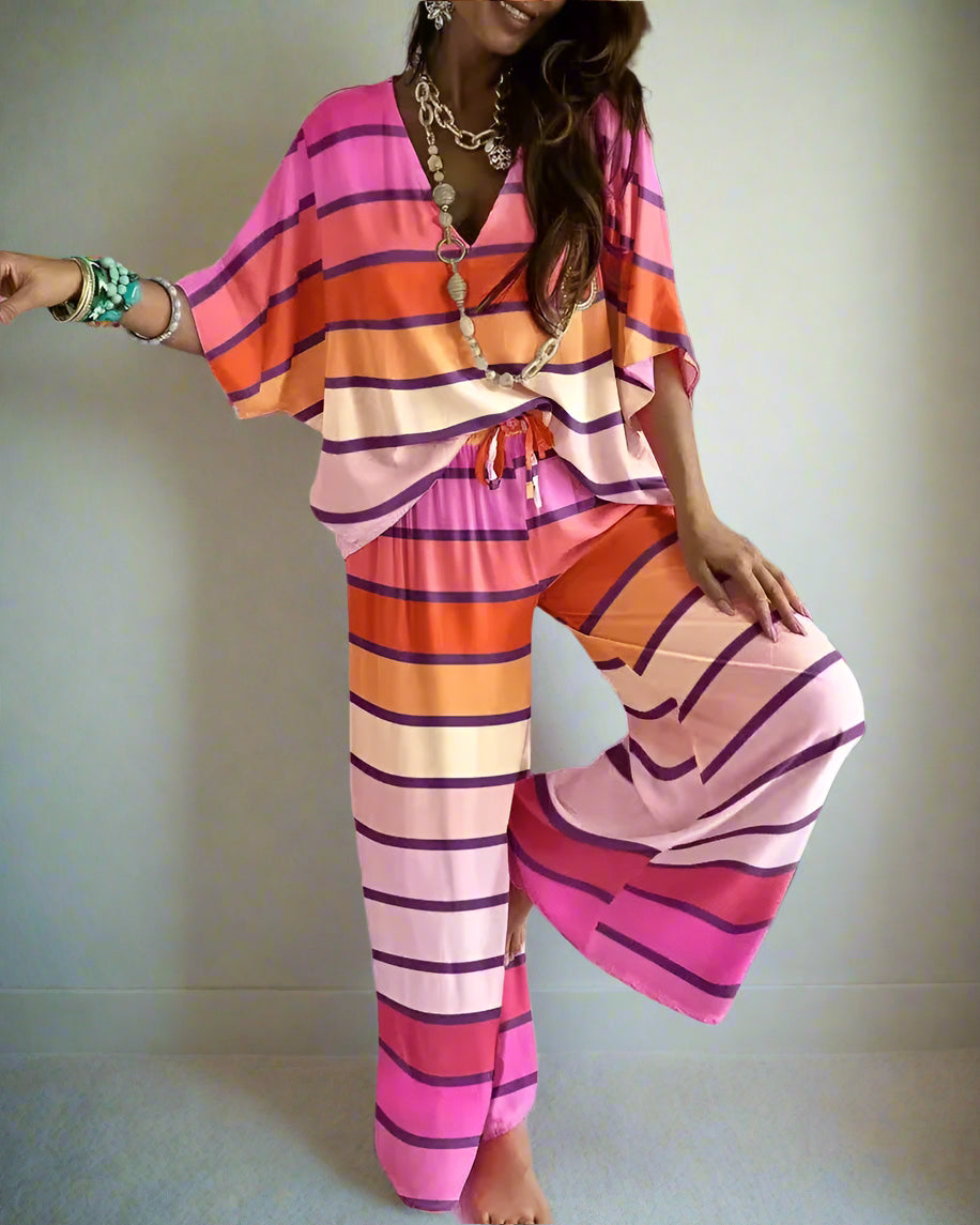 Person wearing a colorful striped pant outfit i