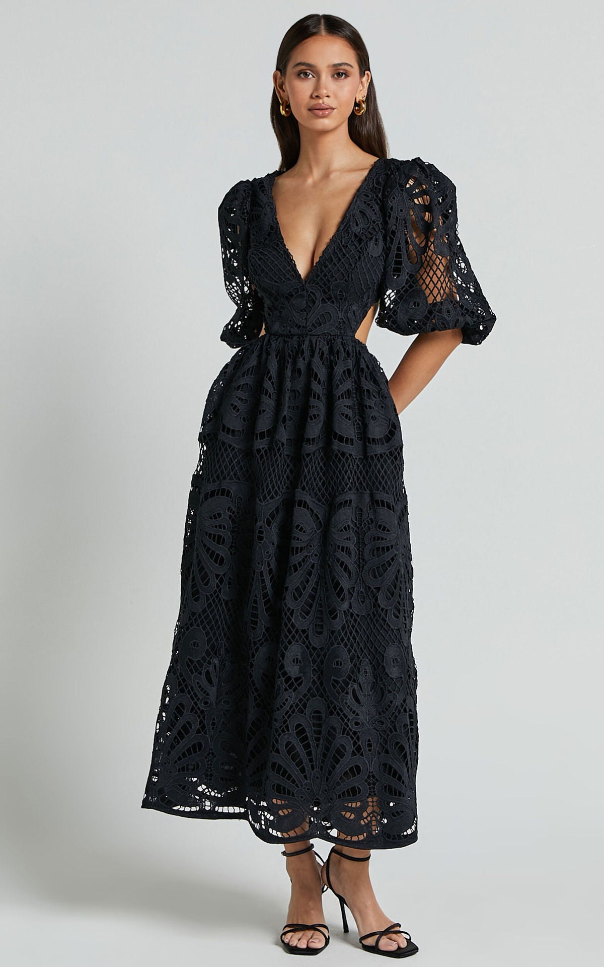 Black lace dress worn by a model 