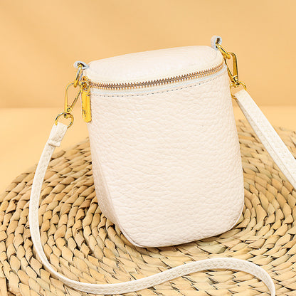 White woven leather handbag with a gold zipper 