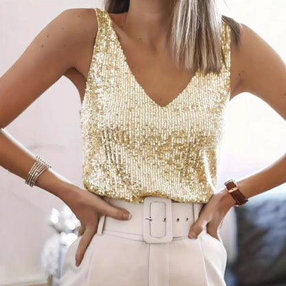 luxurious gold sequin top and white pants on a blond lady 