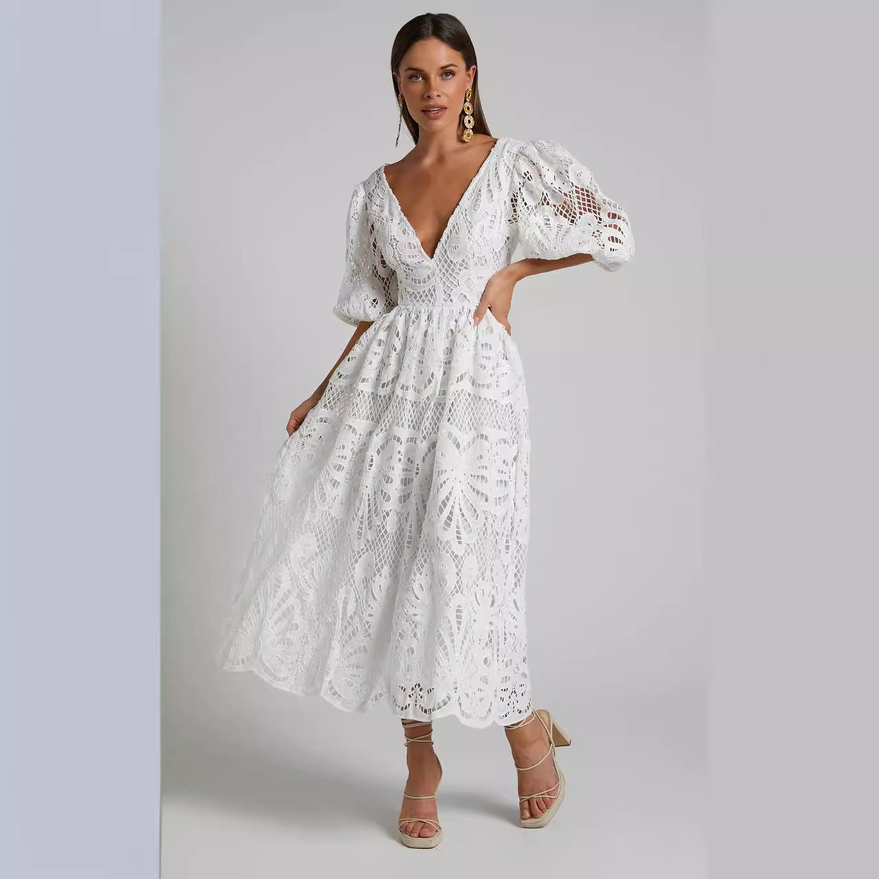 Woman wearing a so elegant white lace dress 