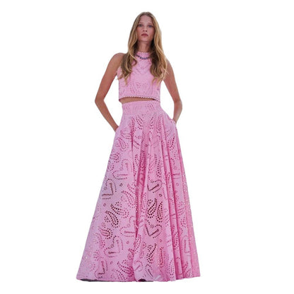 model wearing a pink lace skirt and sleeveless top outit 