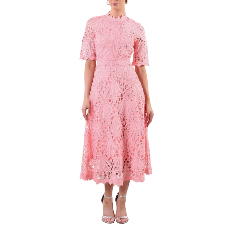 Model in pink lace embroidered dress showing full skirt and delicate texture
