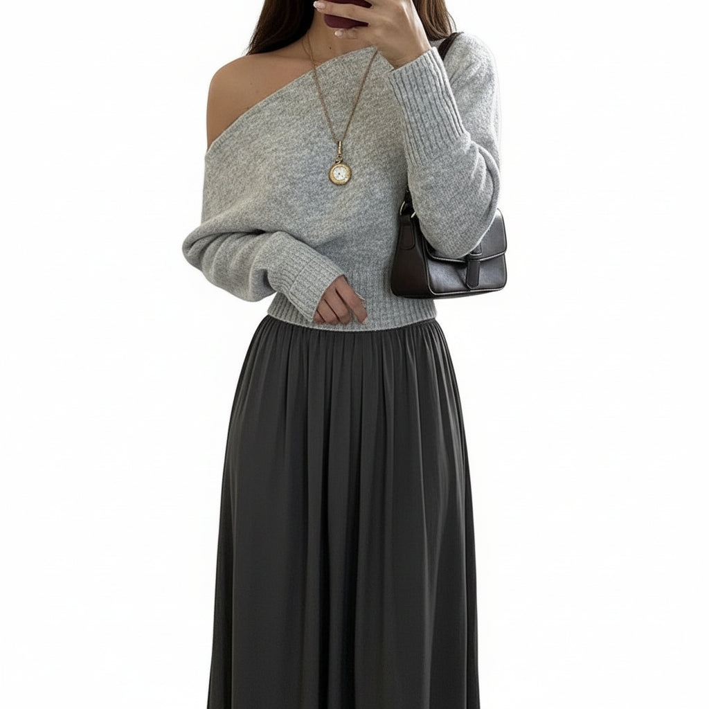 Person wearing a gray off-shoulder sweater 