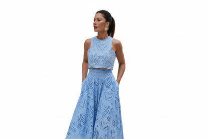 Woman wearing a light blue lace skirt set 