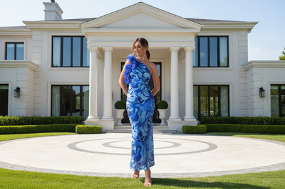 Blue floral print evening dress side view showing slim silhouette and sleeveless design
