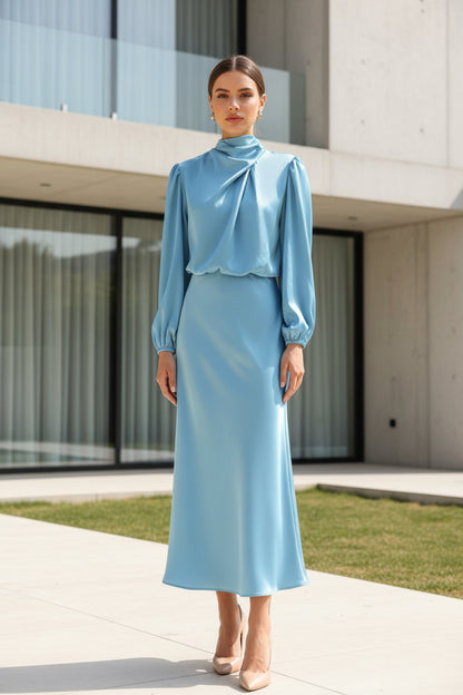 Matte satin halterneck dress – front view showing defined waist and flowing midi skirt
