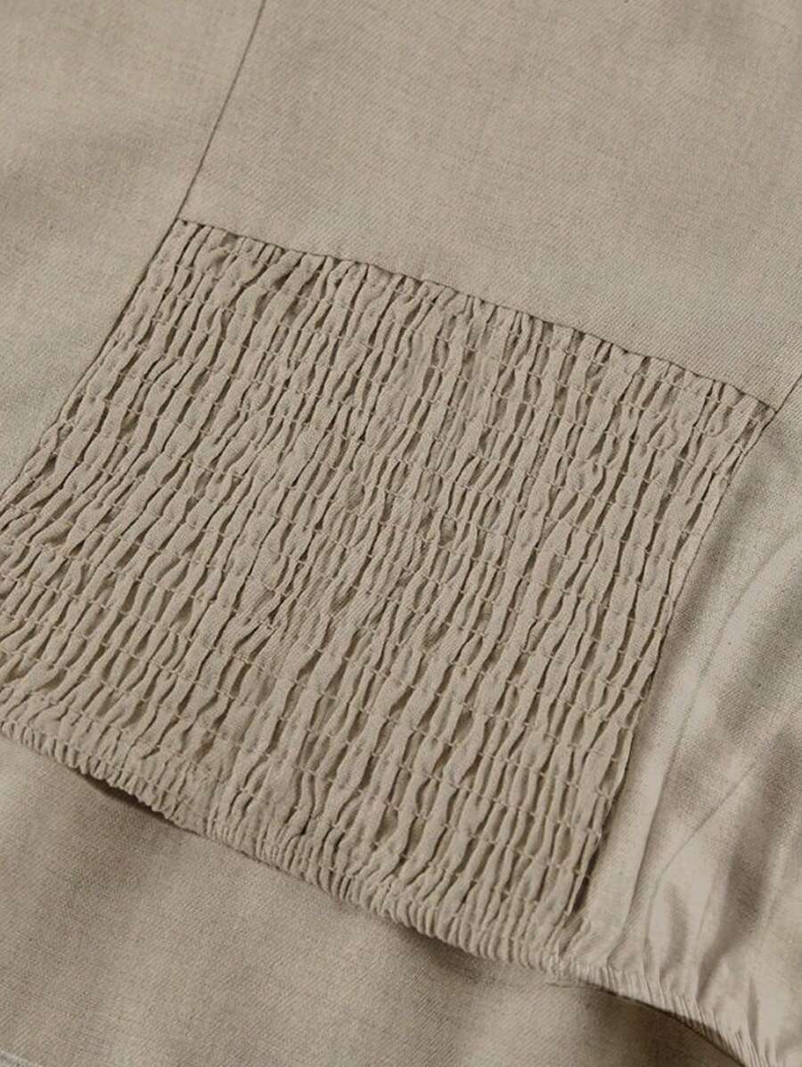 Close-up of textured beige fabric with a pocket detail