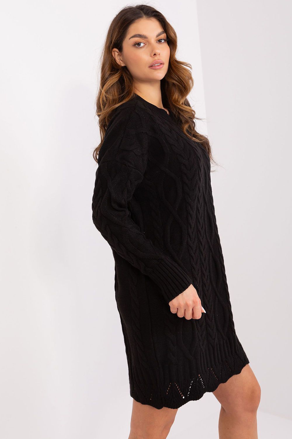 Woman wearing a black knit dress  with long sleeves from france 