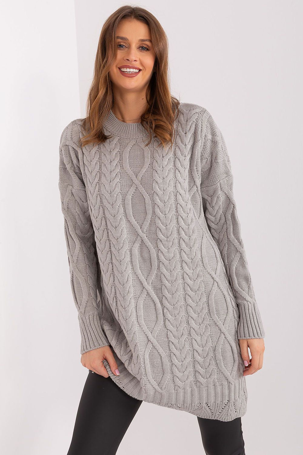 Woman wearing a gray cable knit sweater daydress 