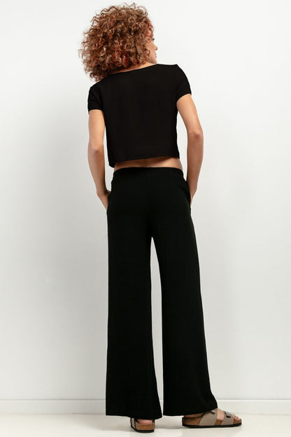 Black linen trousers with relaxed fit, perfect for casual days