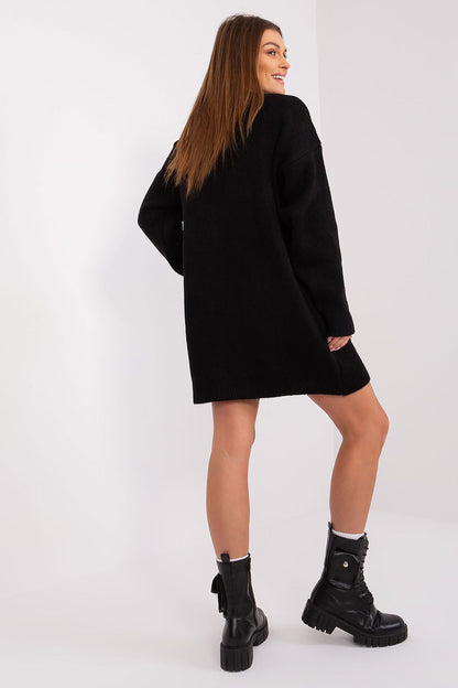 Back view of elegant long sleeve knit dress with feminine silhouette