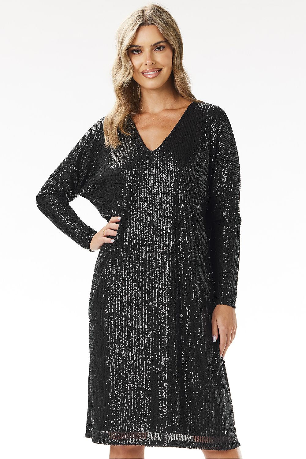 Woman wearing a black sequin dress best outfit for the holiday 
