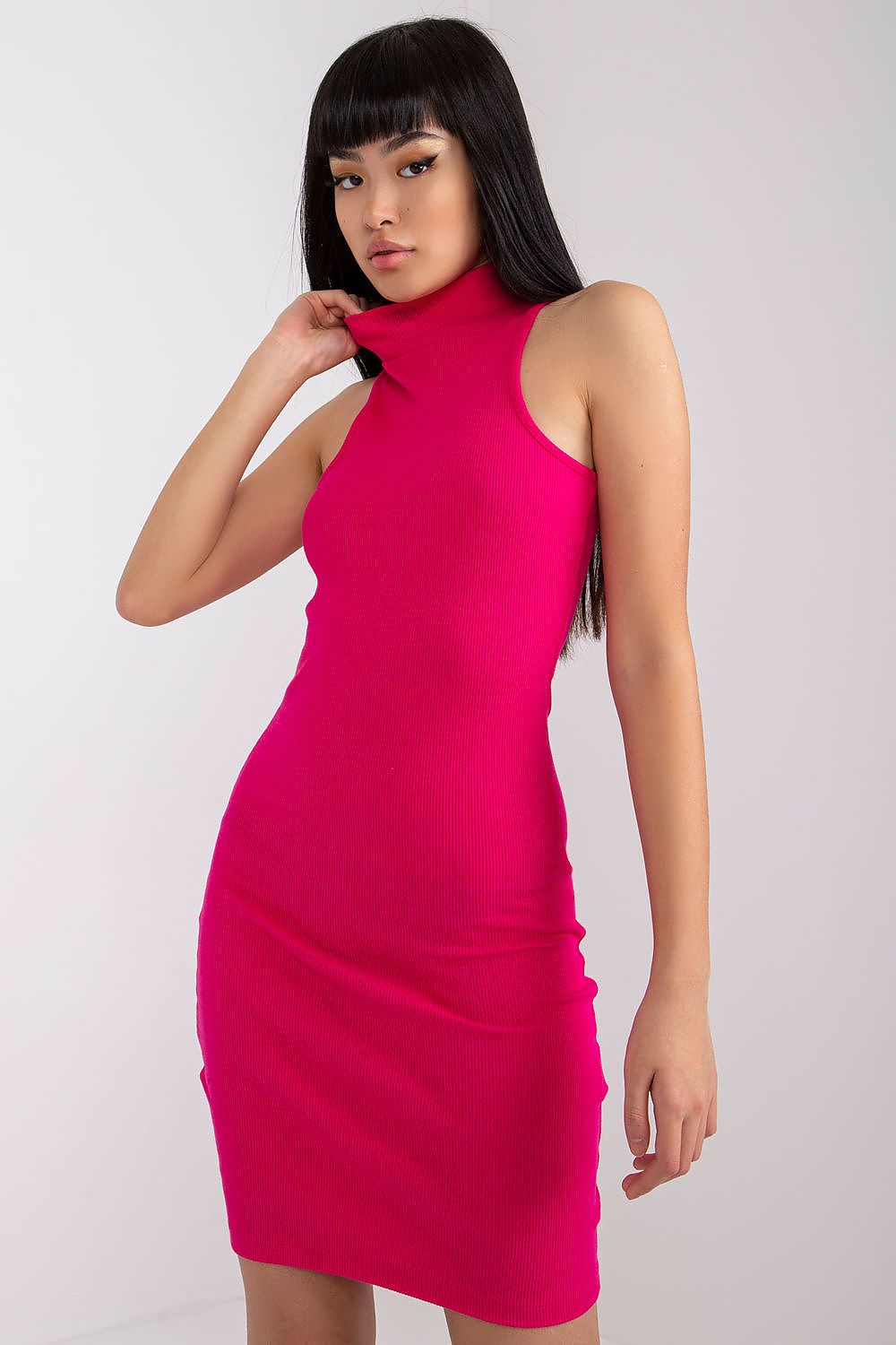 Woman wearing a bright pink dress  from rue paris france 
