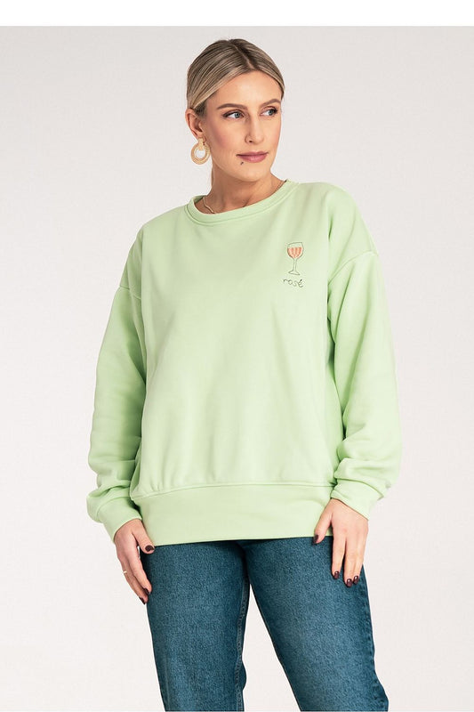  light green sweatshirt with a small graphic on a plain 