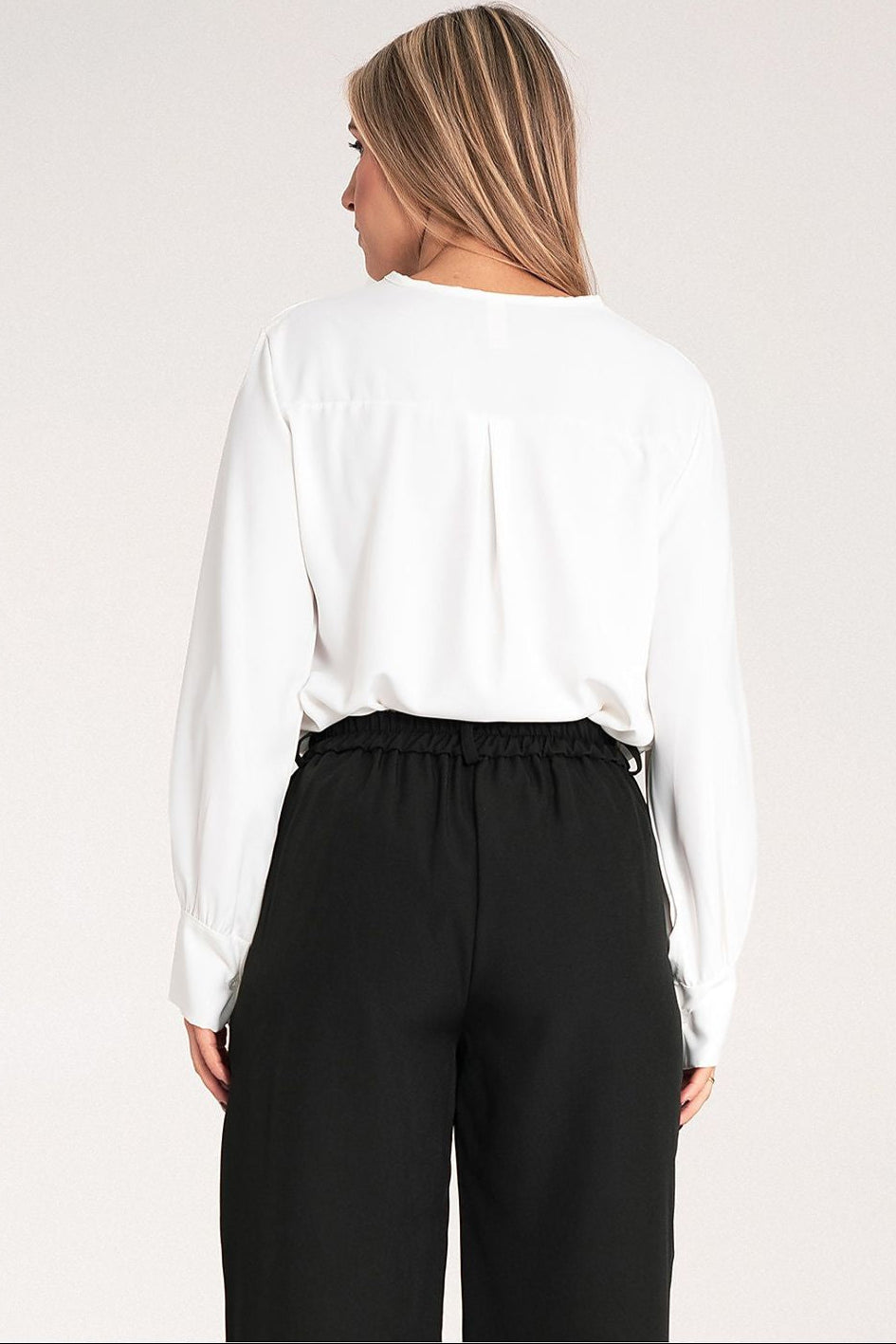back look of a white blouse made of high quality materials 