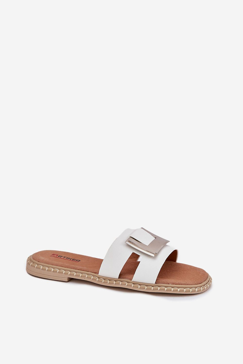 White sandal with a brown sole and a silver buckle 