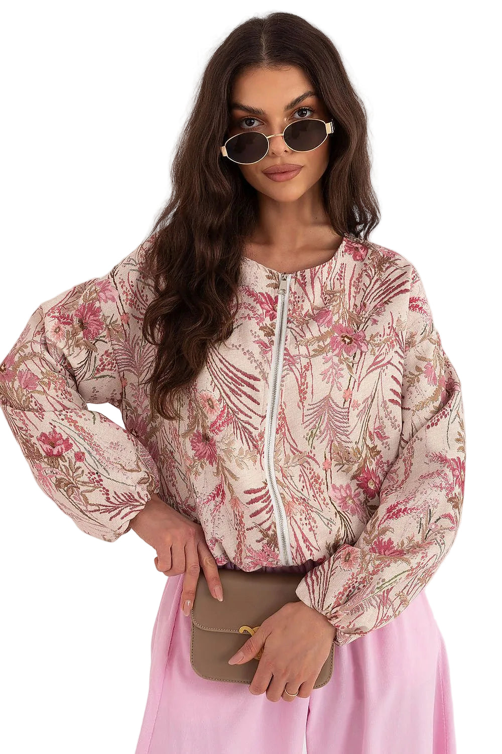 Front view of a model wearing a pink floral print long-sleeve button-up blouse with pink trousers
