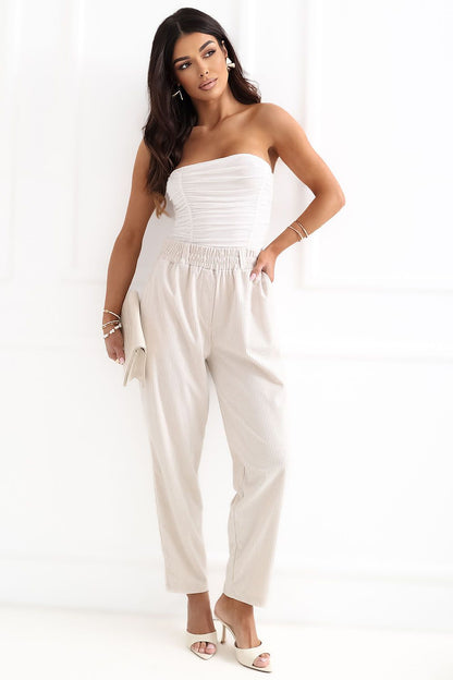 Model in white ribbed corduroy trousers 