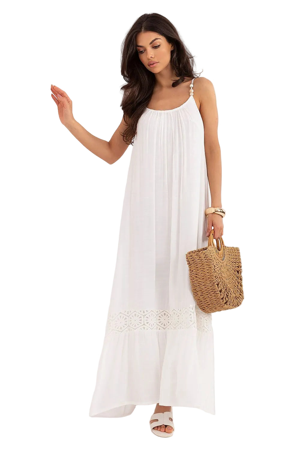 Front view of a model spinning in a white summer boho maxi dress, showcasing its loose, flowing fit and thin shoulder straps.