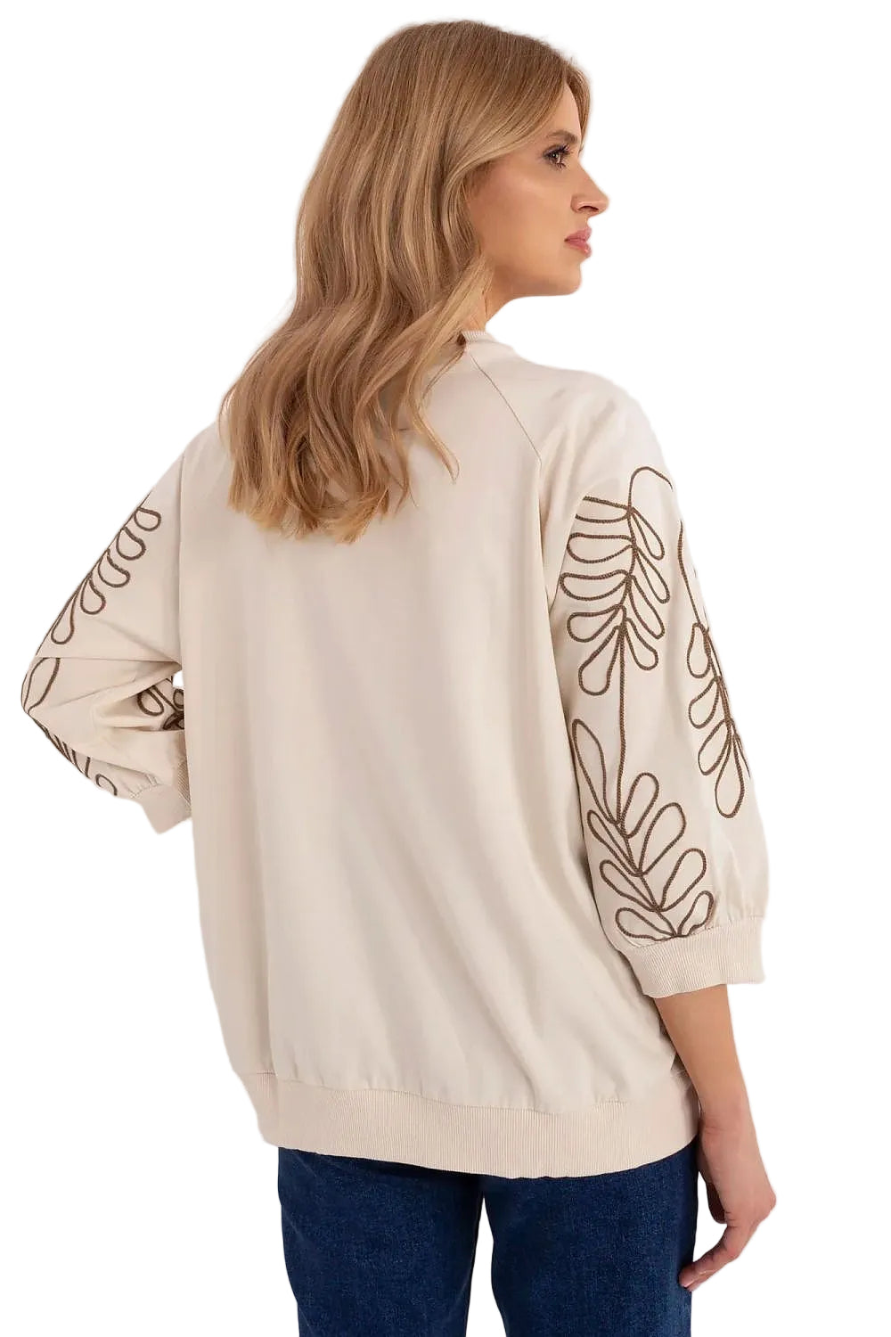 Back view of a beige women's sweatshirt with line-art floral embroidery running down the long sleeves.
