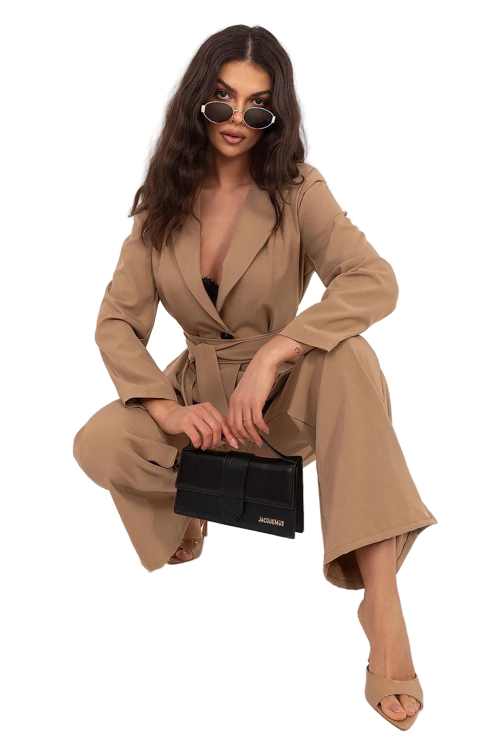Side-angle view of a woman walking in an Italy Moda brown two-piece blazer and high-waisted wide-leg pants set.