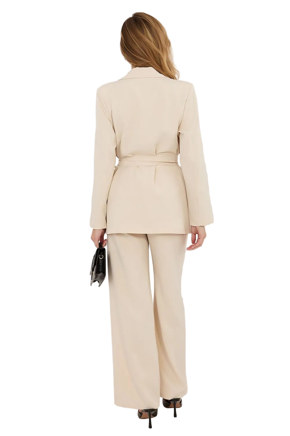 Back view of a model in a camel-colored tailored blazer and trousers set, highlighting the clean shoulder lines and premium European construction.