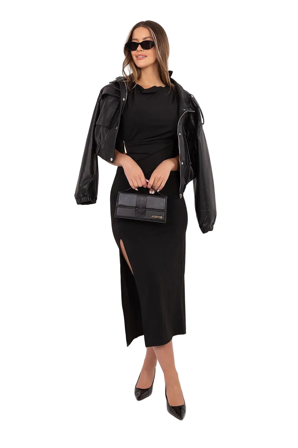 Woman in a black coktail outfit with a leather jacket and black shoes 