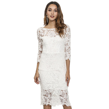 Elegant mid-length formal wear in pristine ivory with ornate cutwork
